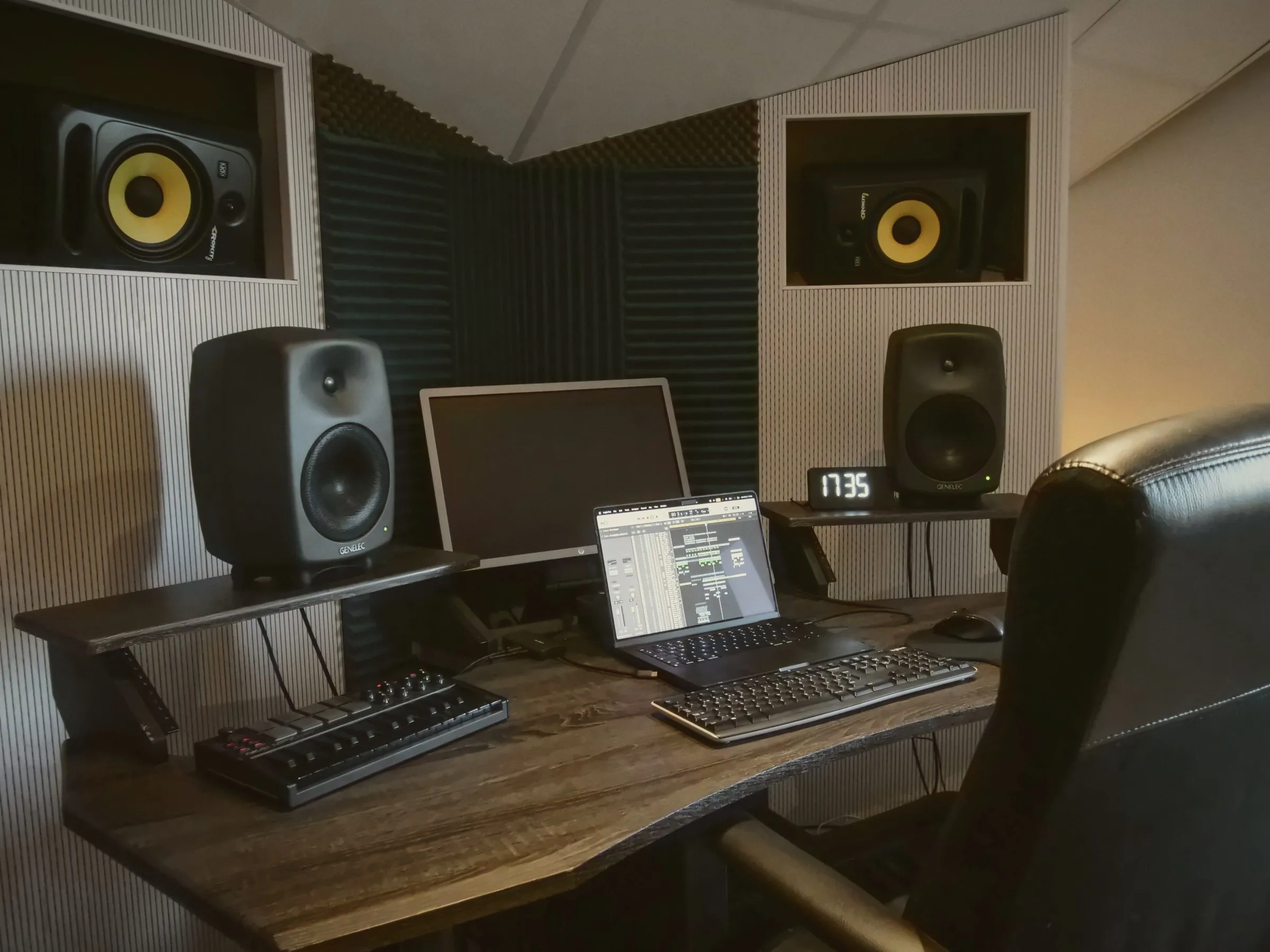 Ivory in Årsta: desk with Genelec monitors and KRK speakers built into the wall