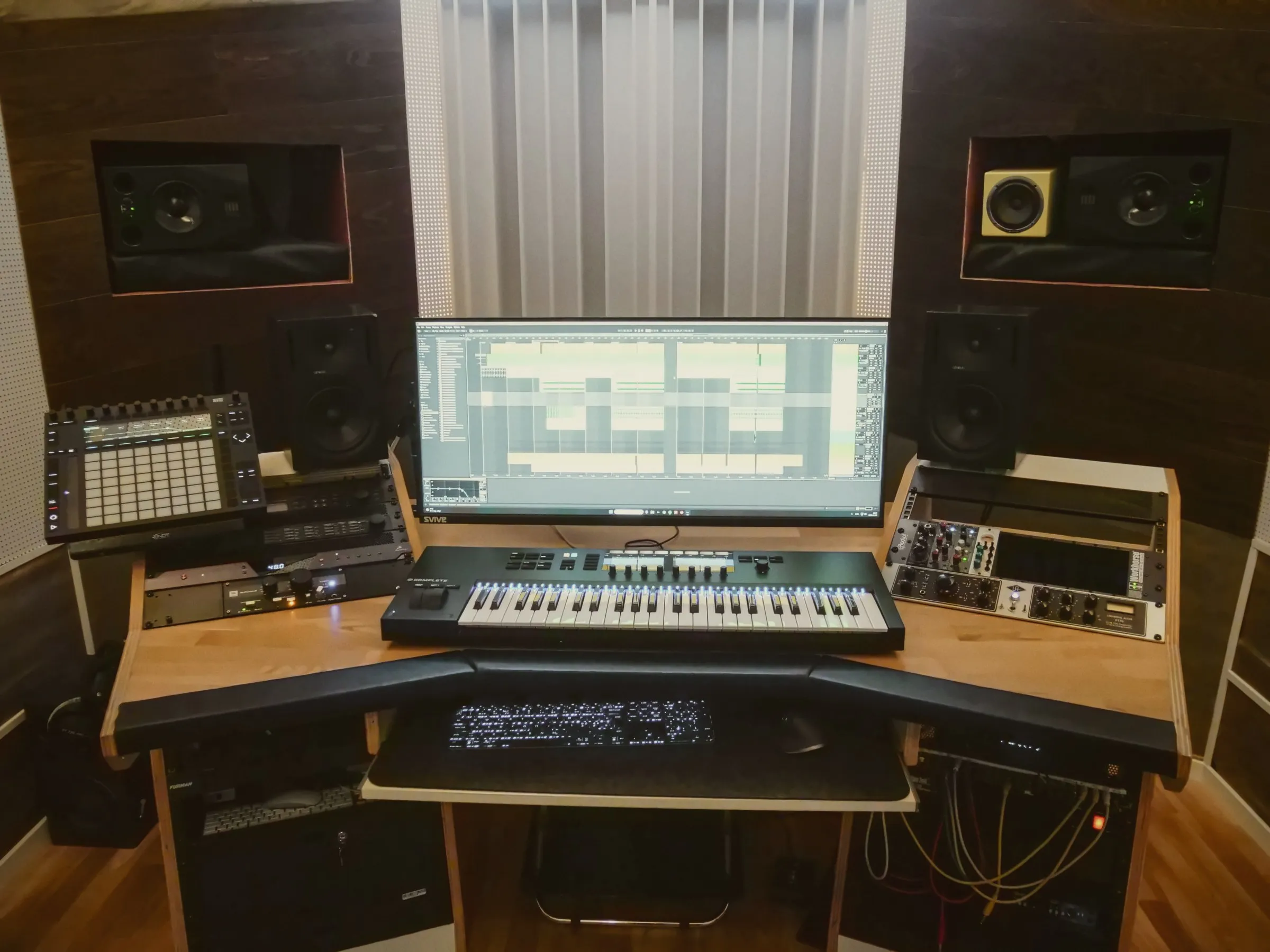 The workstation in Onyx with monitors, keyboard and analog gear